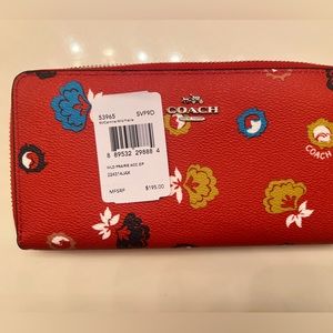 Brand new with tags beautiful red floral coach wallet.